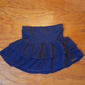 Girls tiered ruffled faux jean skirt w/ attached privacy shorts.
